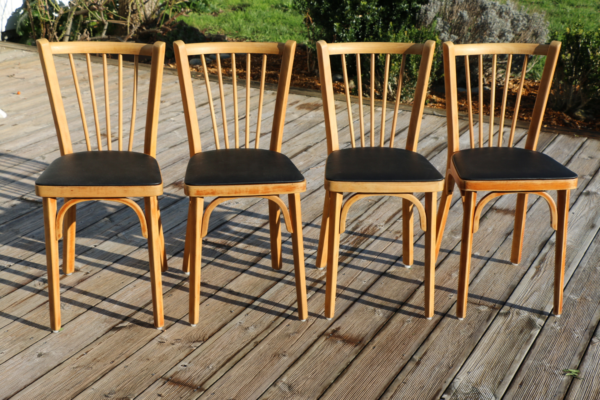 4 chaises BAUMANN N°12 skaï noir hêtre clair