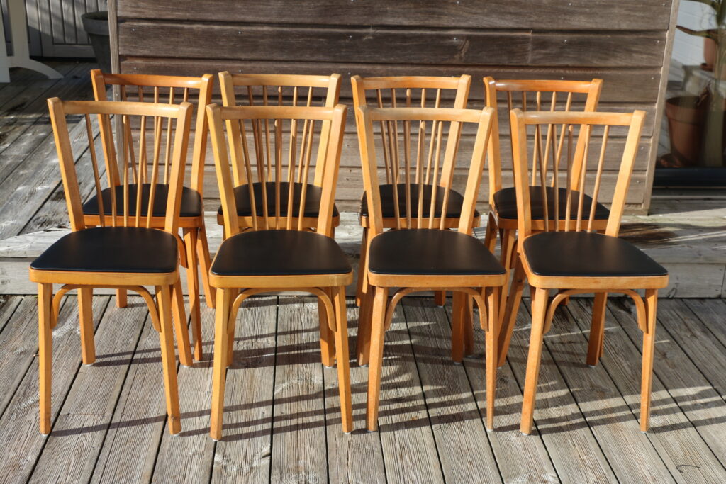 8 chaises BAUMANN N°153 skaï noir hêtre clair